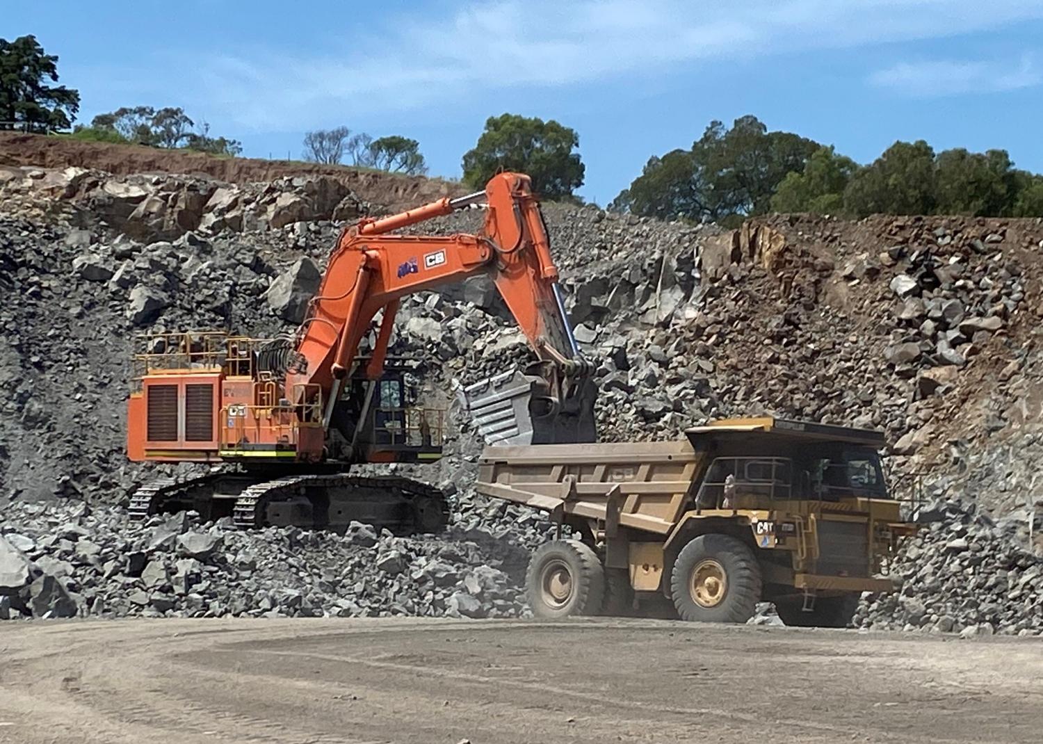 Cleary Bros excavator and truck during the Marulan operation